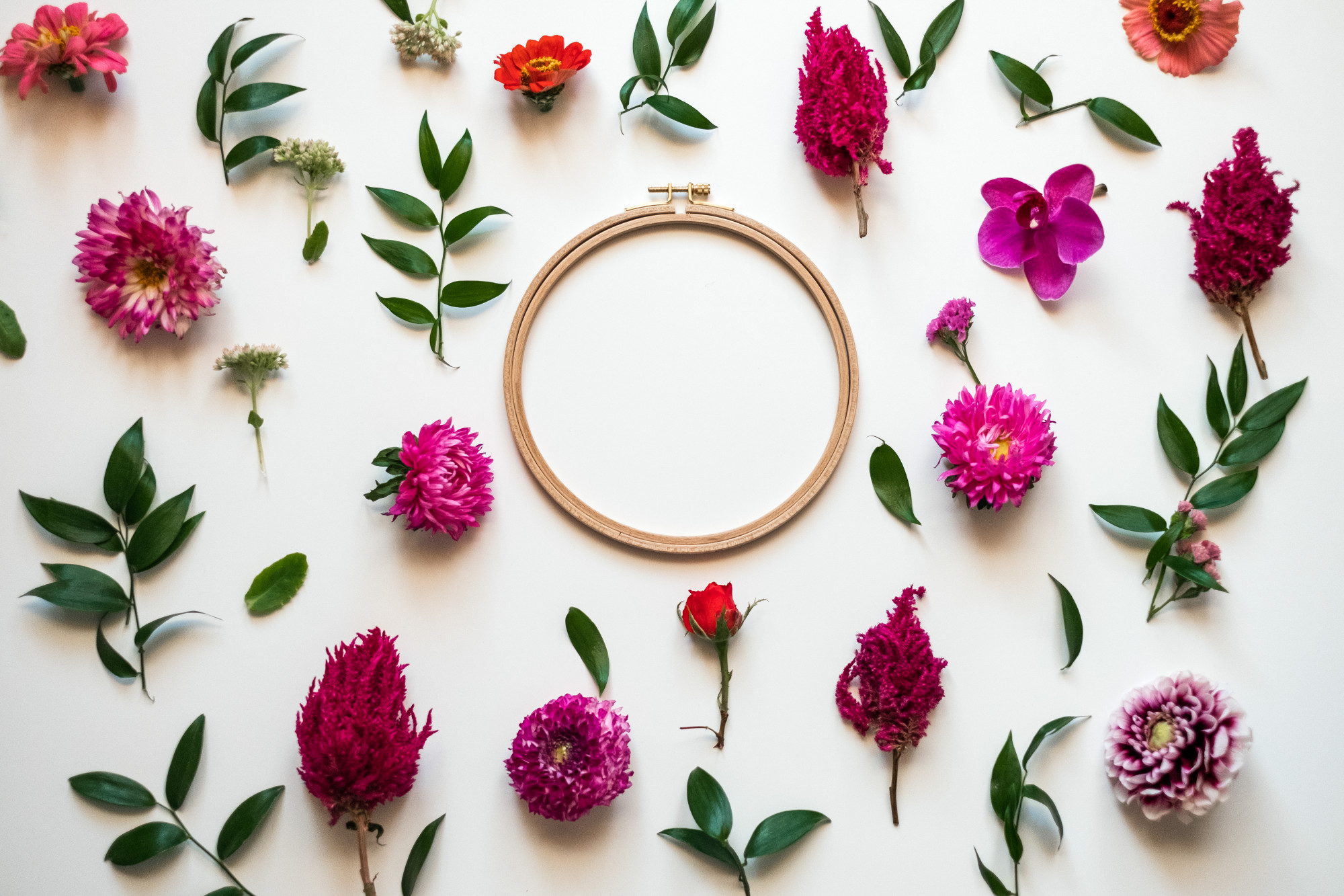 close-up of handcrafted embroidery hoop with floral motif